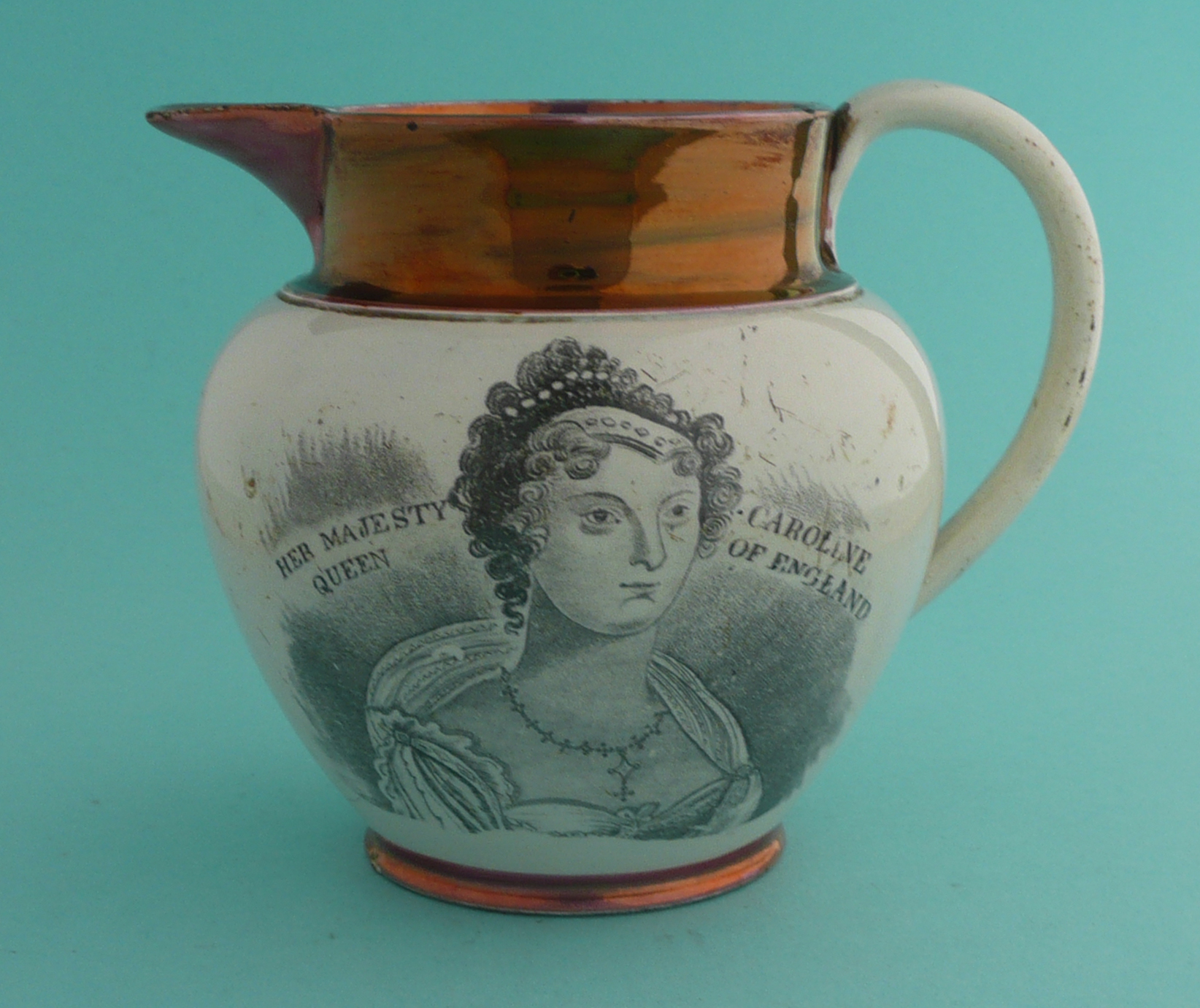 1820 Queen Caroline: a pearlware copper and pink lustre jug printed with a named portrait and on the