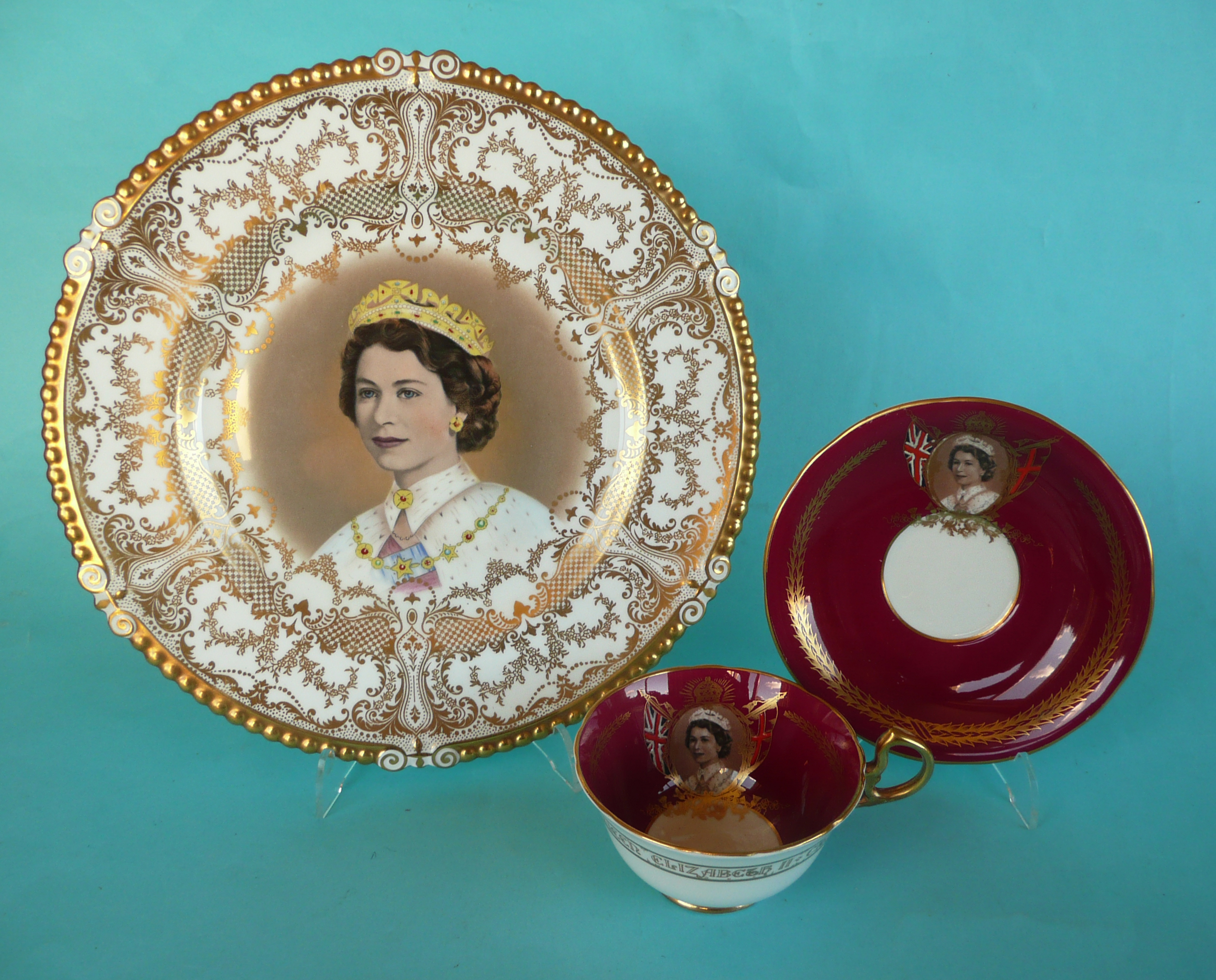 1953 Coronation: an Aynsley plate withy profuse gilt decoration and a maroon ground Aynsley cup