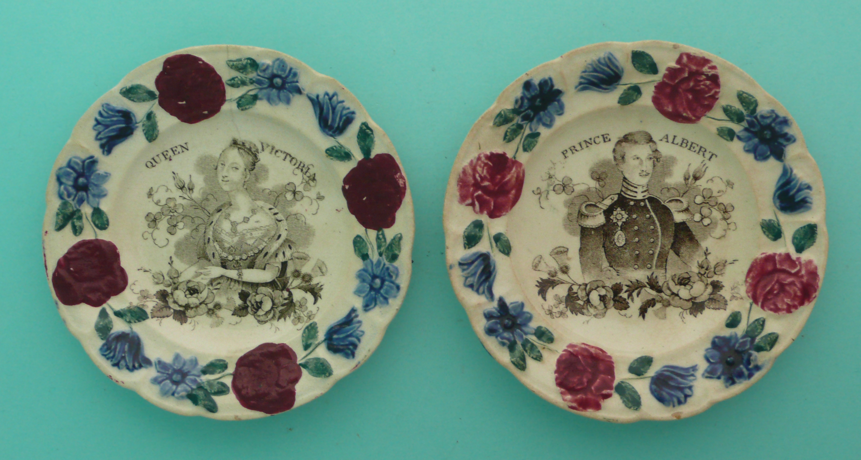 1840 Wedding: a rare pair of nursery plates with colourful floral and foliate moulded borders,