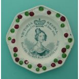 1838 Coronation: an octagonal nursery plate the florette moulded border enamelled in green and