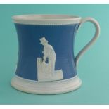 Cricket: a pottery mug the waisted body coloured blue and moulded in white with figures, circa 1850,