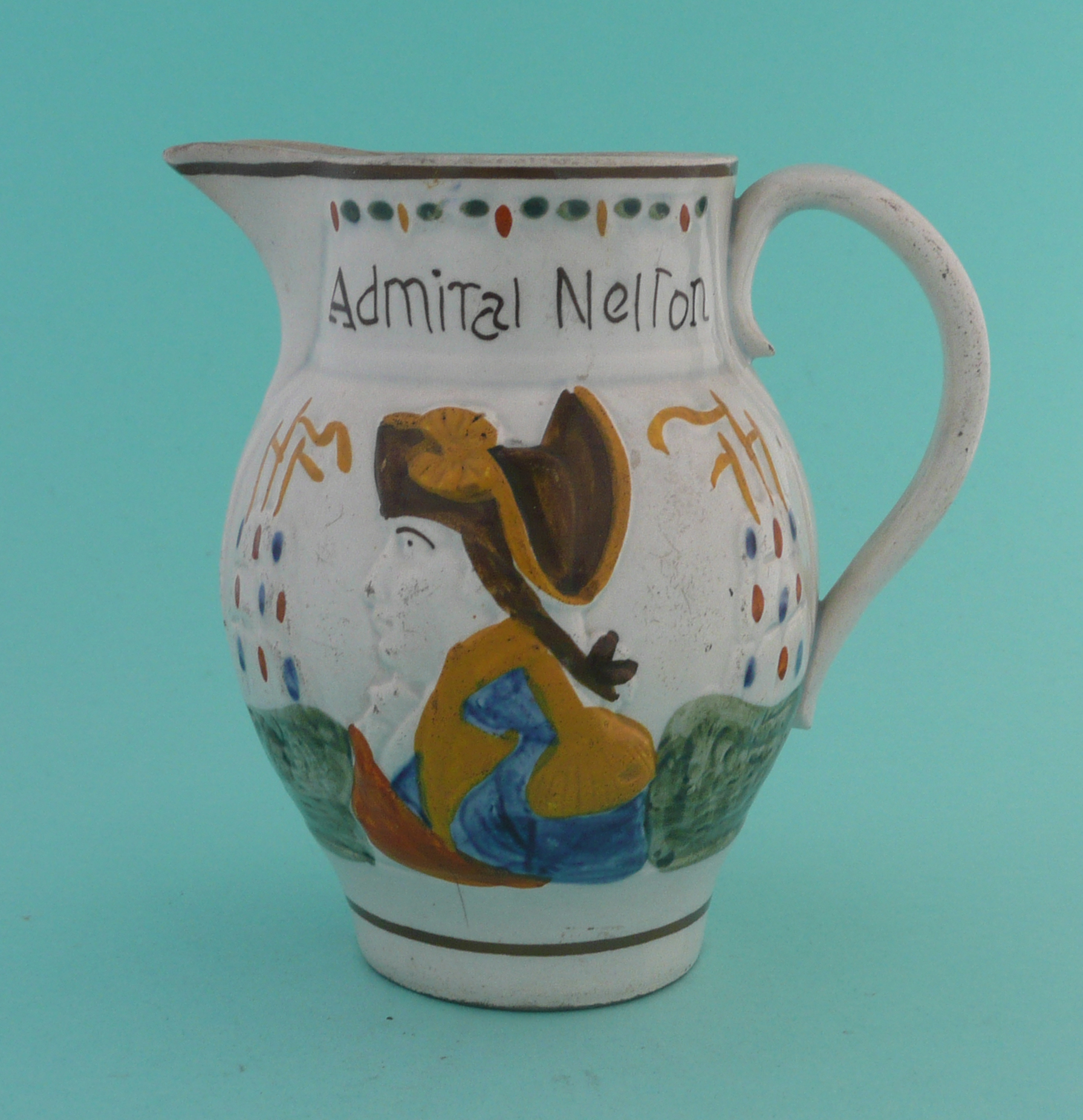 Admiral Nelson and Captain Berry: a Prattware jug painted in colours, circa 1798, 127mm. * See