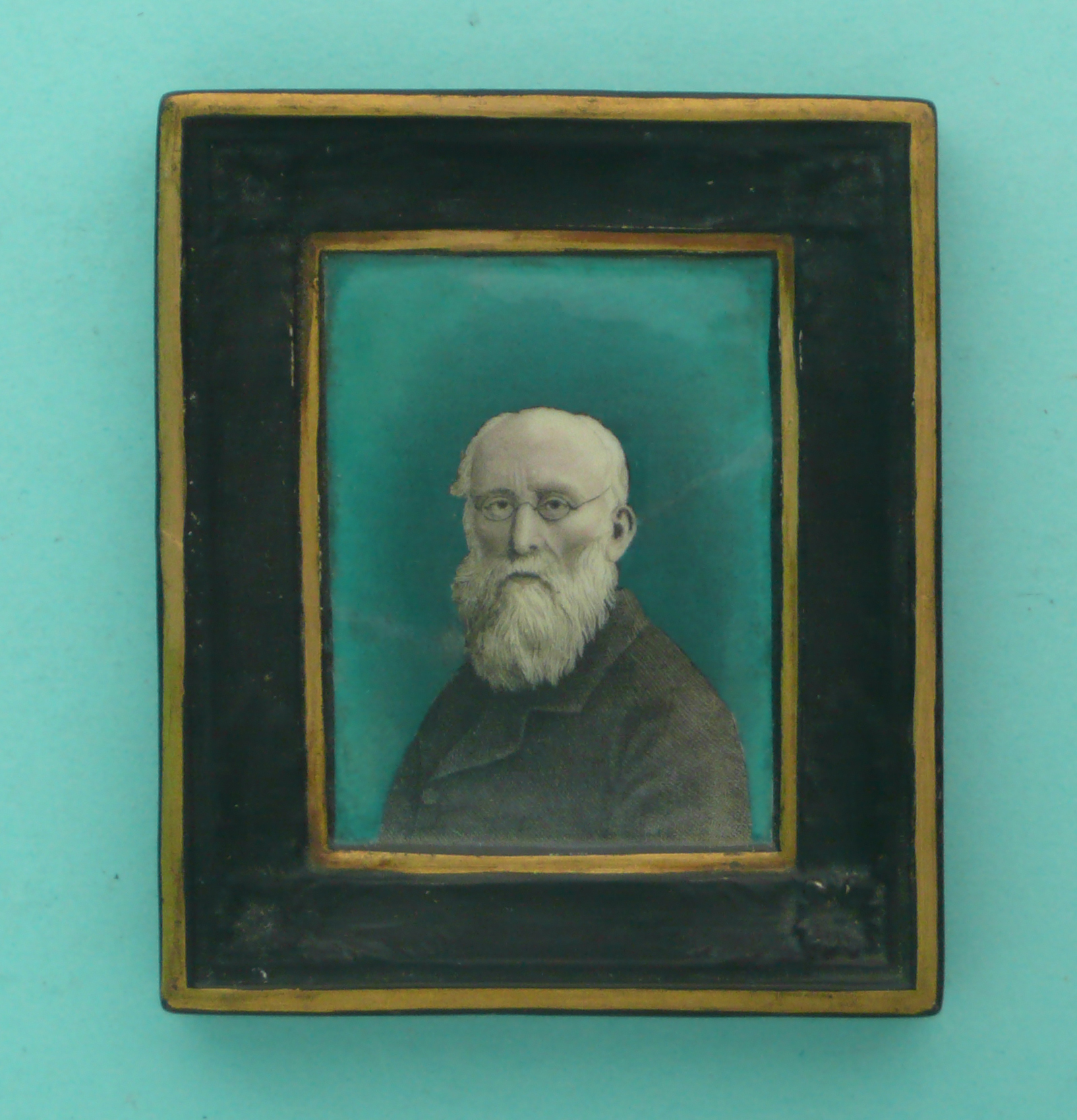 A plaque moulded with integral frame: Felix Edwards Pratt (173) green ground, restored. * Ex