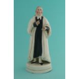 Rev John Wesley: a Staffordshire pottery figure depicted standing, circa 1840, index figure to right