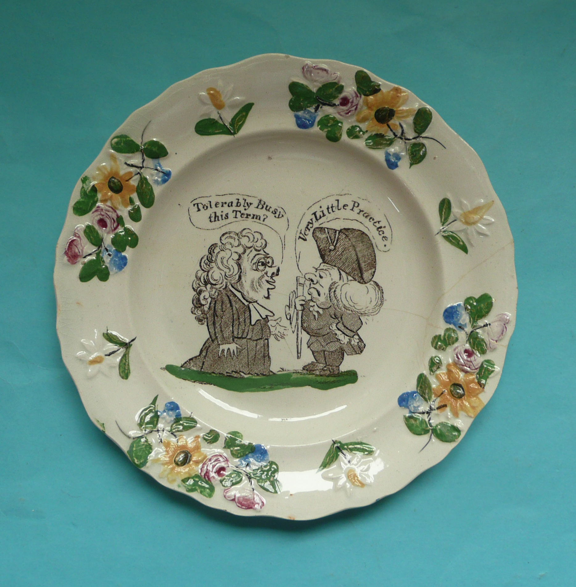 Education: a rare nursery plate on the subject of the beadle, the moulded border colourfully