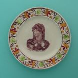 1820 Queen Caroline: a good nursery plate with colourful moulded border printed in brown with a