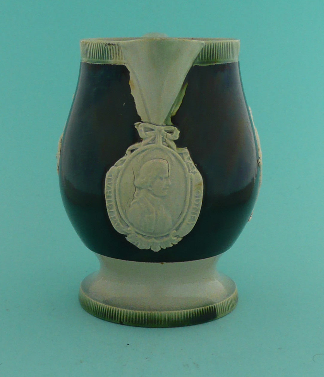 Admiral Rodney: a green glazed earthenware jug, the black ground applied in white with a named - Image 3 of 5