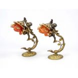 Pair of wall lamps, late 19th century, brass/bronze. Hovering boys on an ornamented holder holding a