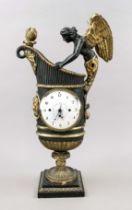 Amphora clock, 1st half 19th century, ebonized wood, partly gilded, angel figure and god's head on