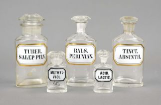 5 apothecary jars, 19th century, glass, labels with gold rim. Stopper partially chipped, h. up to 19