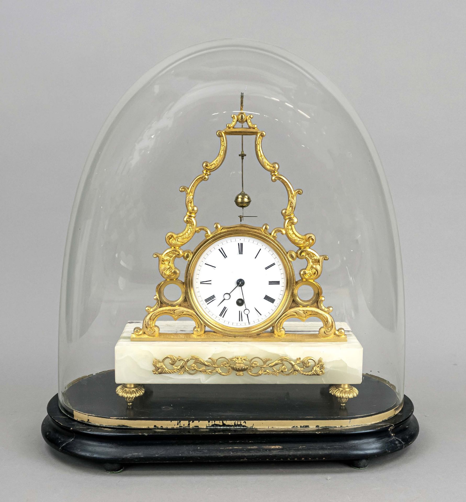 Table clock with fire-gilt body on onyx base, rocaille decorated with gilt roundels, white enamel