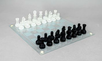 Chess set, 20th century, game board and complete set of pieces, clear and black glass, h. up to 7.