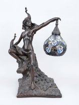 Lamp with woman and peacock, 20th century, bronzed cast metal. Female nude on a rock base holding