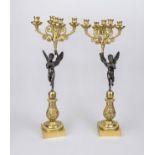 Pair of figural candlesticks, 19th century, bronze, brass, partially gilded. Winged messengers of