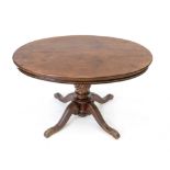 Louis-Philippe salon table, c. 1860, mahogany, oval top on turned base, h. 74 cm.