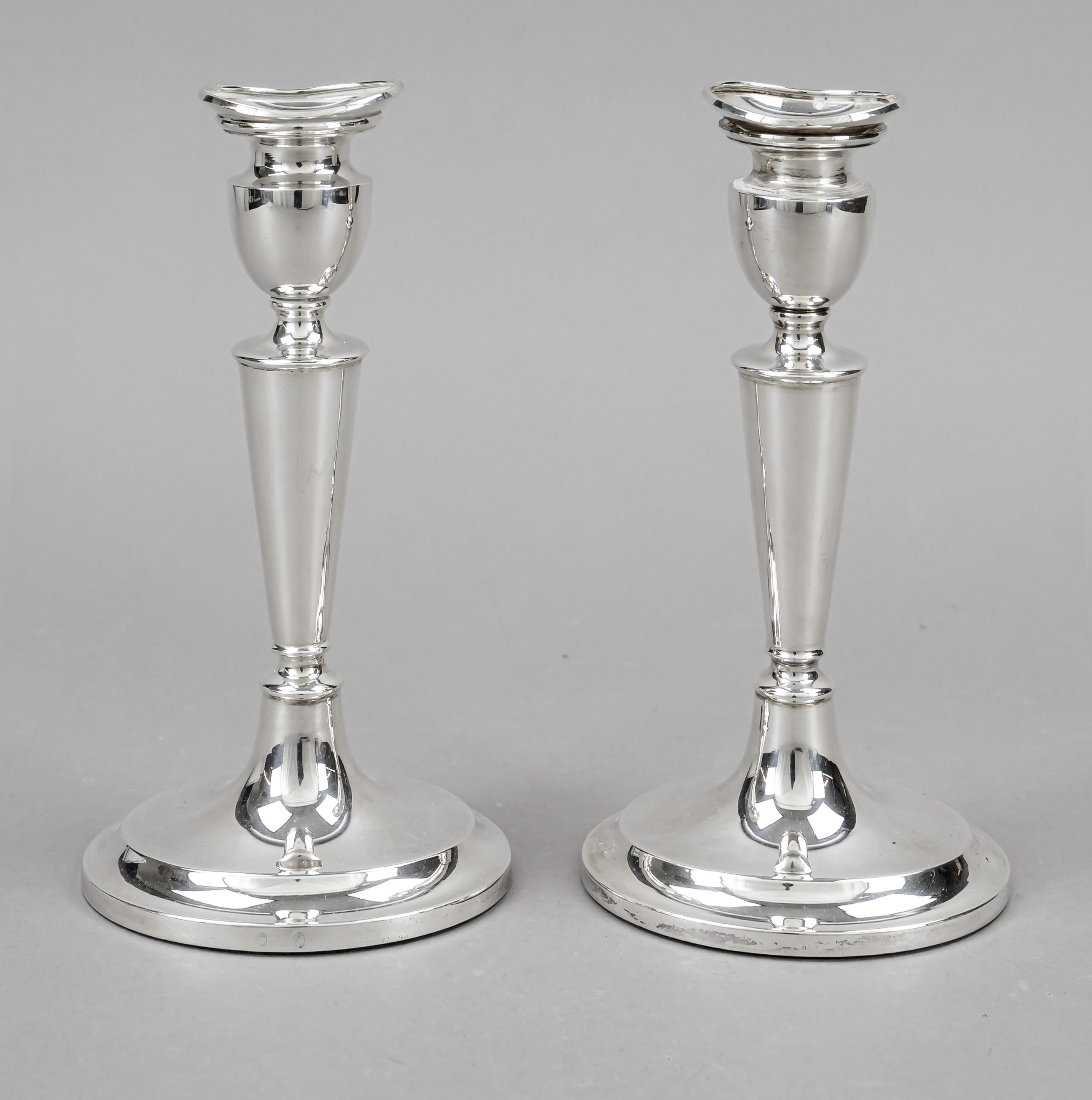 Pair of candlesticks, 20th century, silver 830/000, oval domed stand, conical shaft, vase-shaped