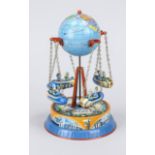 Mechanical carousel, 20th century, 4 rockets? on a globe on a round base, rubbed, h. 21 cm