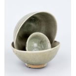 3 Longquan celadon bowls (kiln washers), China, probably Song period. H. 23 cm