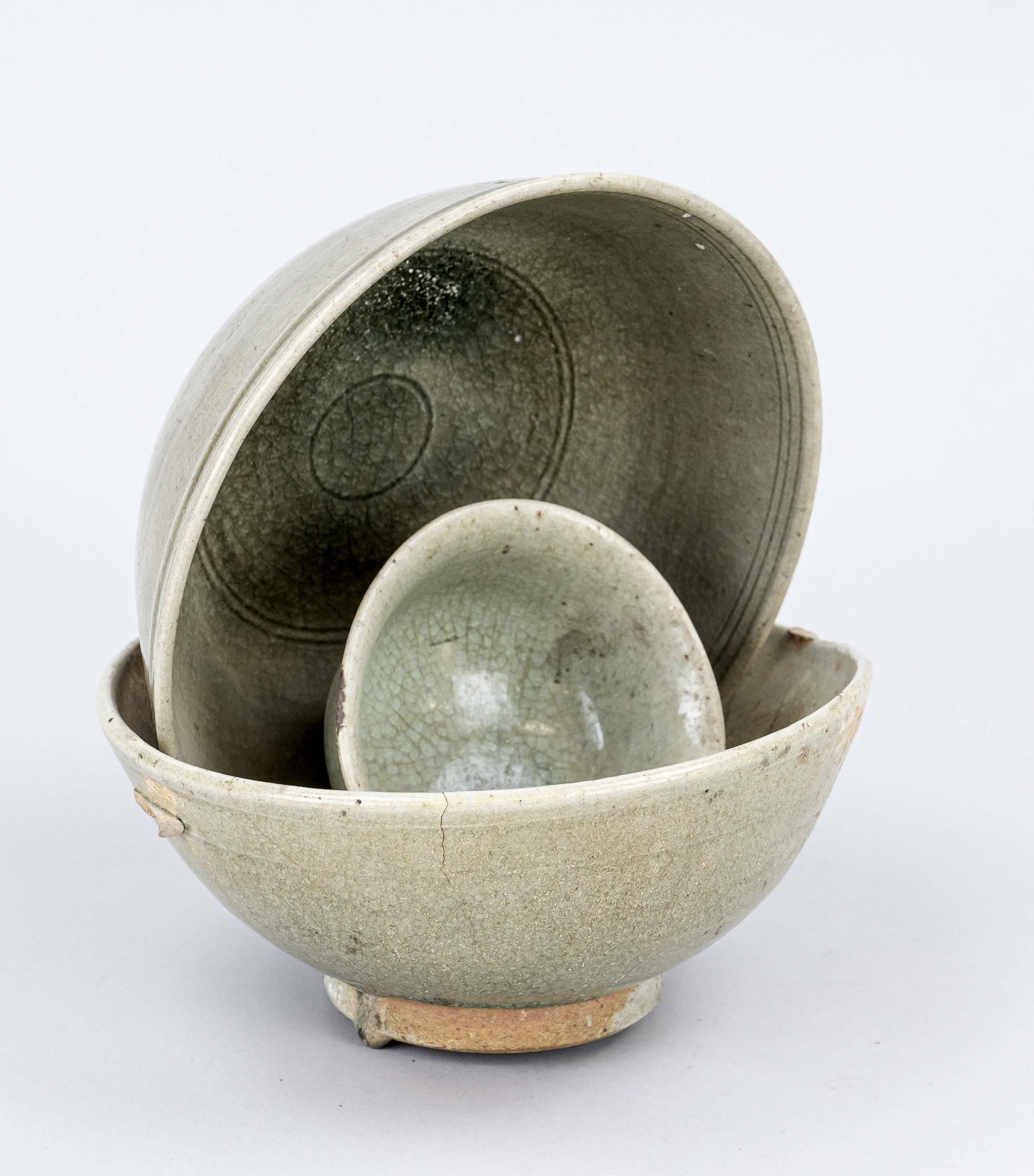 3 Longquan celadon bowls (kiln washers), China, probably Song period. H. 23 cm