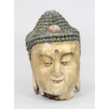 Large Buddha head, China?, light wood with polychrome painting. Heavily weathered on the underside