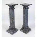 Pair of flower columns, 20th century, dark gray polished stone with natural pattern, smooth shaft