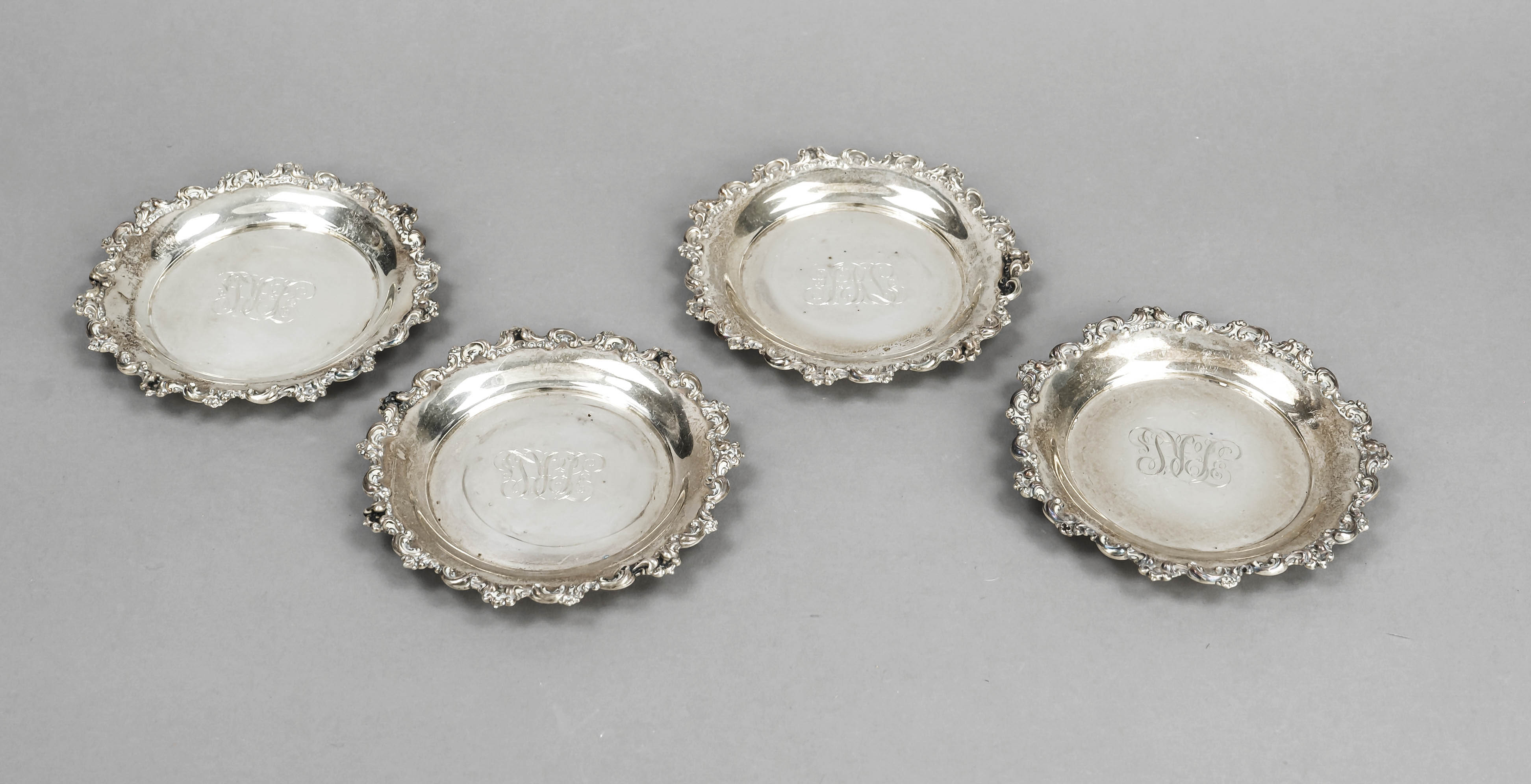 Four coasters, USA, 20th century, maker's mark Meriden Brittania Co, Connecticut, sterling silver