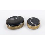 2 pillboxes, 19th century, base and lid made of black agate with beautiful pattern and structure,