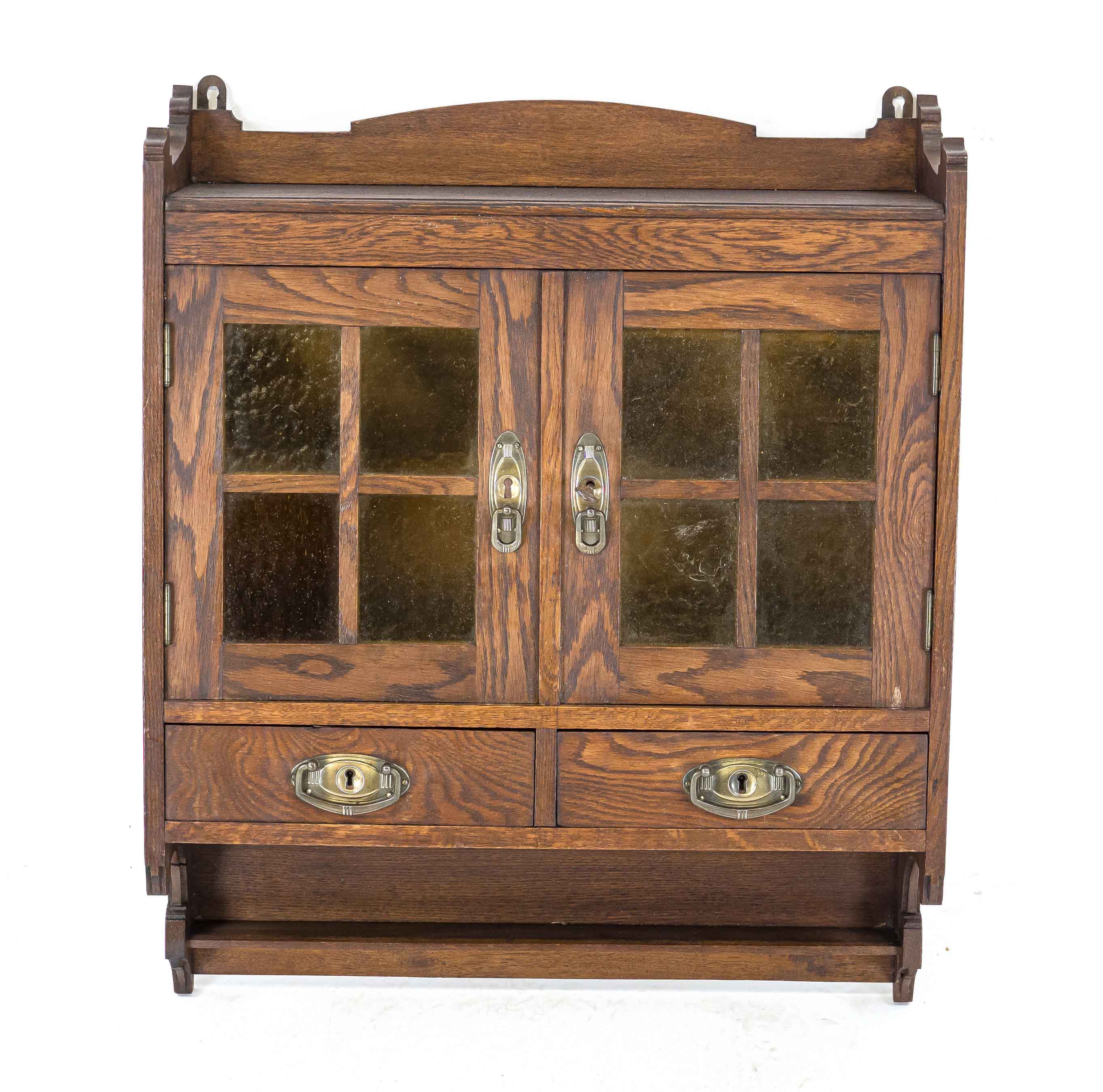 Hanging cupboard around 1910, oak, two doors with green glass and two drawers, 75 x 60 x 21 cm