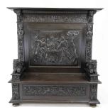 Large chest bench around 1880, ebonized oak, rich carved decoration, depiction of a drinking