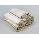 Seven bales of old linen, several meters, w. to 44 cm