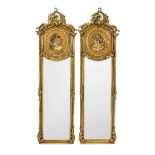 Pair of salon mirrors after an antique model, 20th century, stuccoed wood, gilded bronze, faceted