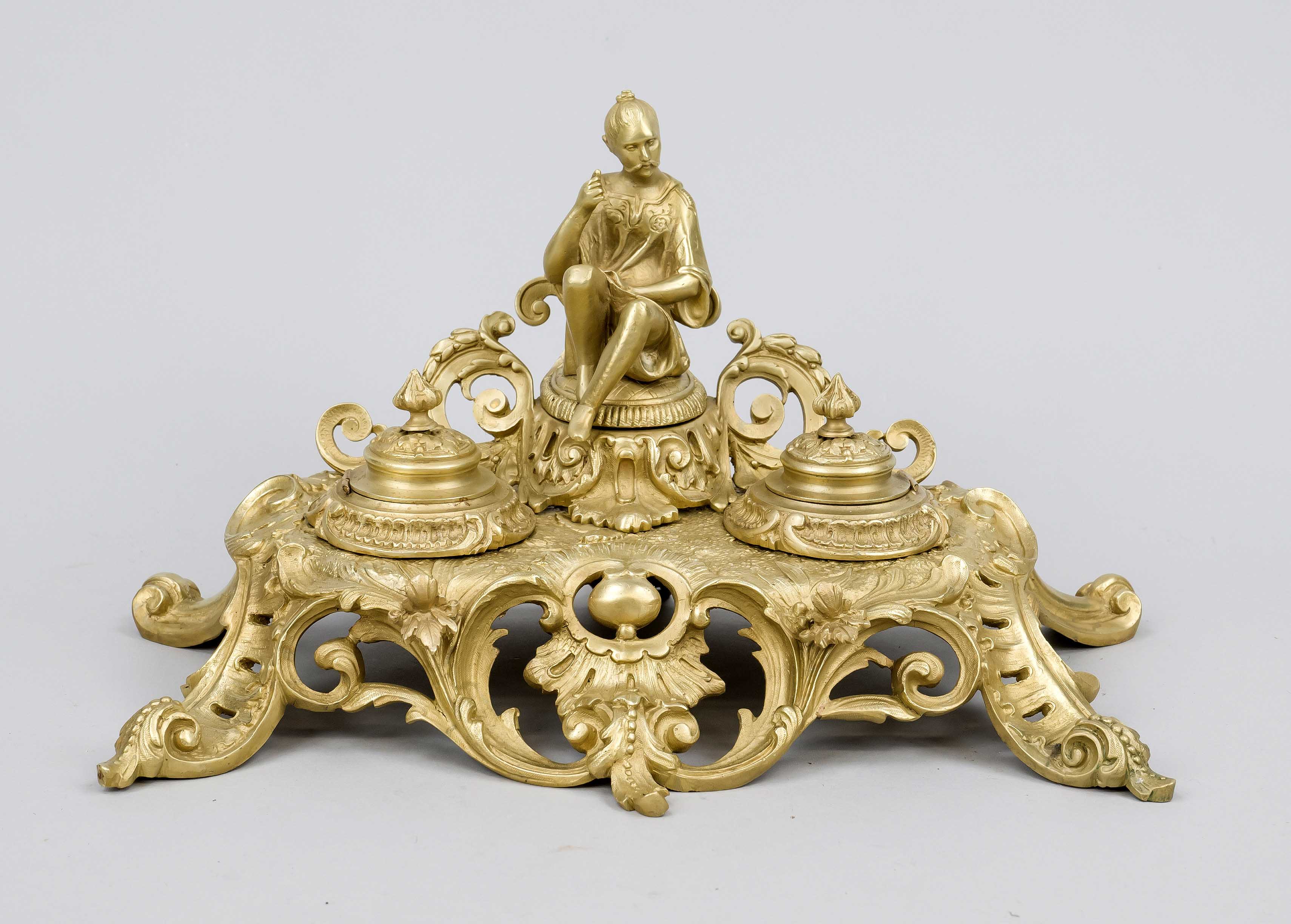 Desk top, late 19th century, gilt bronze. Open-worked with rocailles and acathus leaves. Figural top