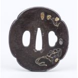 Tsuba (guard), Japan 18th/19th century (Edo period), iron with gold inlay. Mokko form with relief