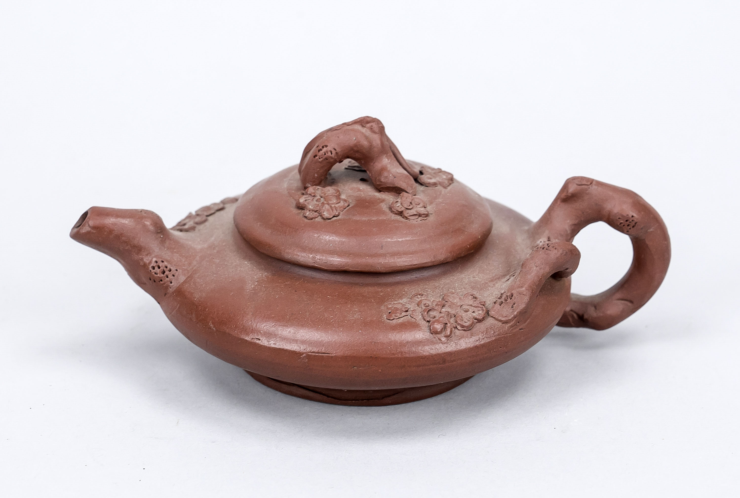 Small Yixing teapot, China, 20th century Handle, knob and spout as gnarled plum branches with