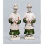 2 Mingqi grave goods, China, exact age uncertain. Ceramic, partially glazed dark green, the heads
