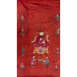 Red silk cloth, China, embroidered with numerous figures and officials on a tiger skin throne,