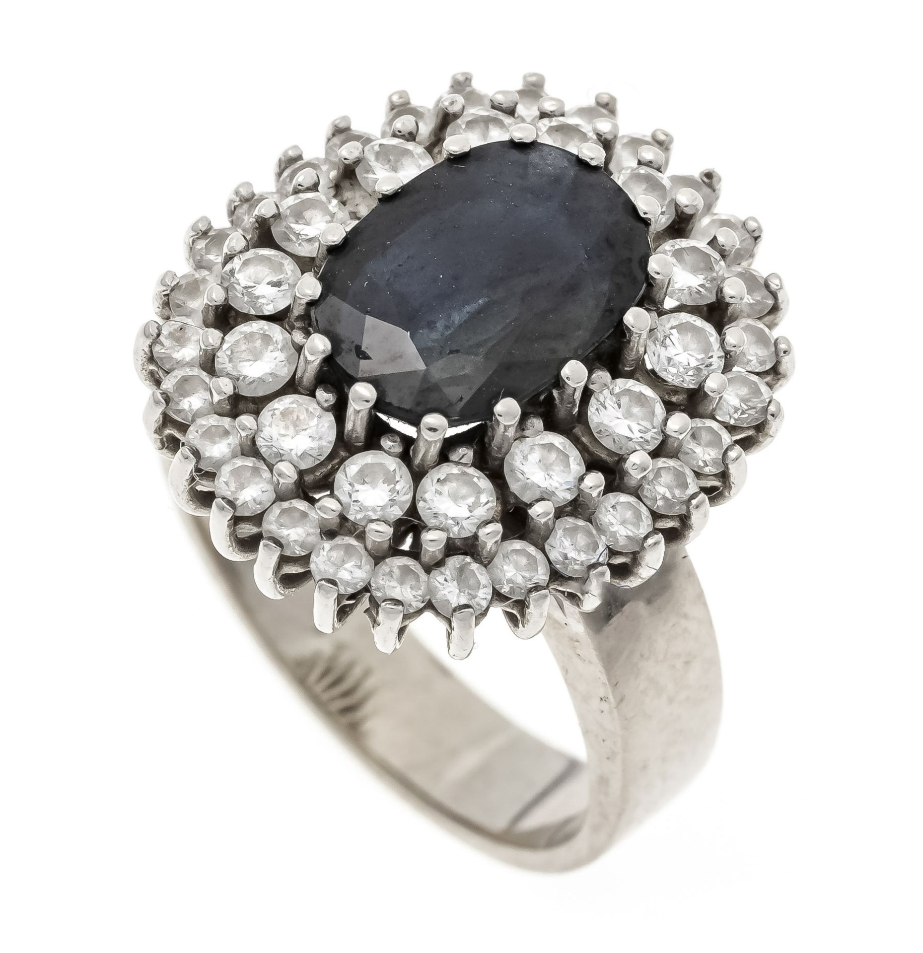 A sapphire and brilliant-cut diamond ring, WG 585/000, with an oval faceted sapphire 1.96 ct dark