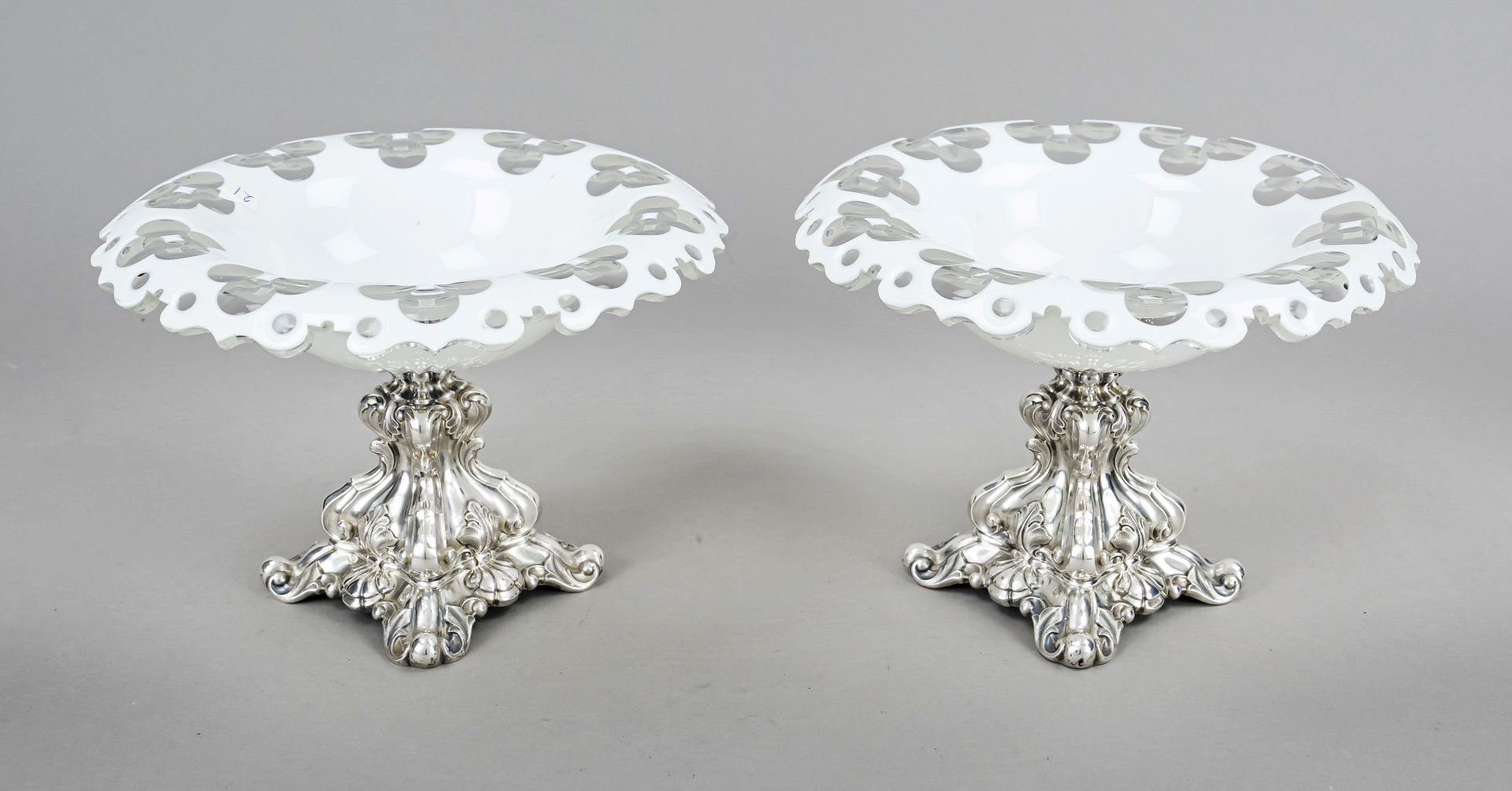 Pair of centerpieces, late 19th century, silver 812/000, curved, square stand, with relief