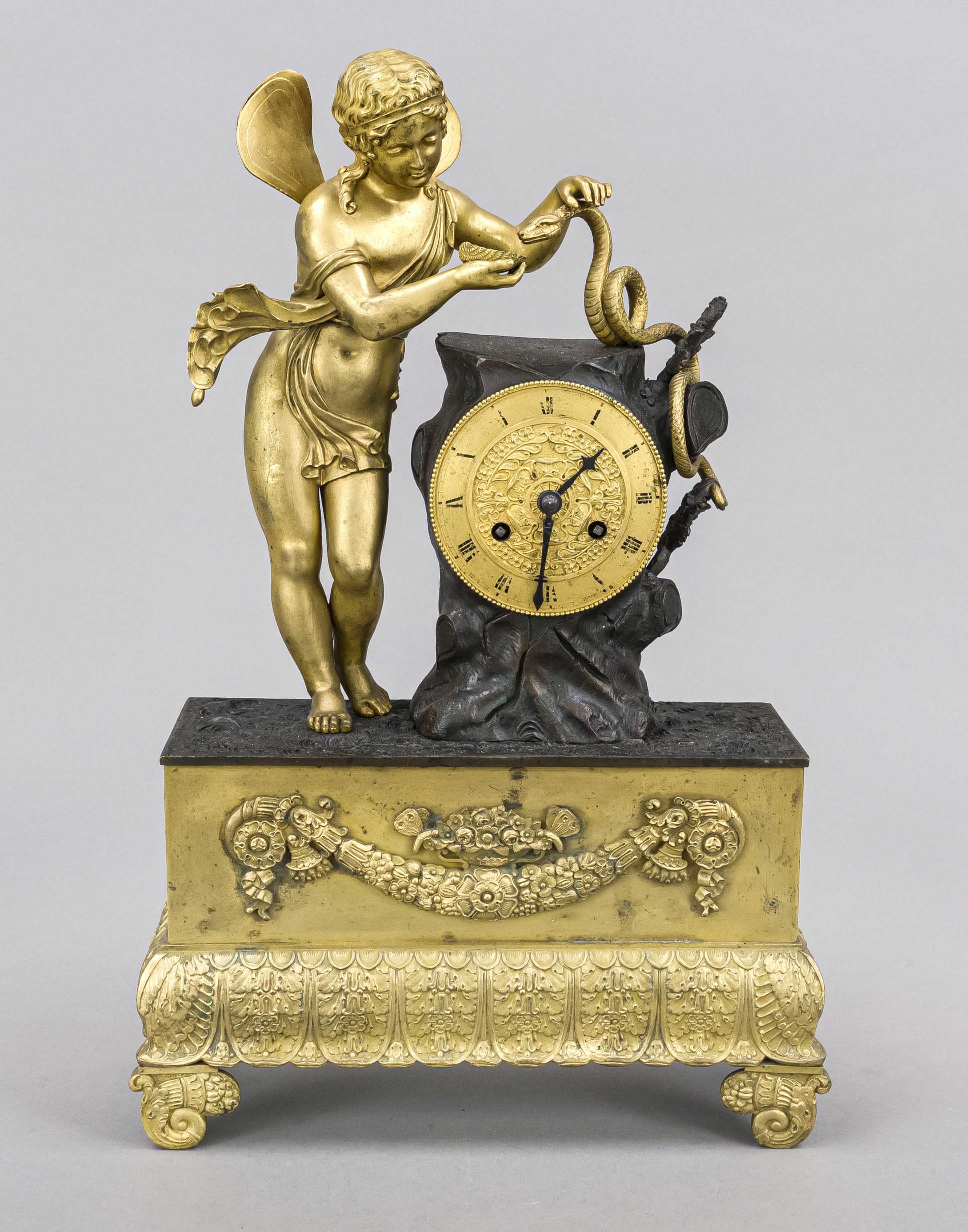 Empire bronze mantel clock, 1st half 19th century, angel with snake on burnished clock base,