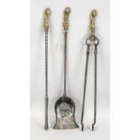 Renaissance-style fireplace set, 20th century, iron/brass. Consisting of tongs, poker and shovel, l.