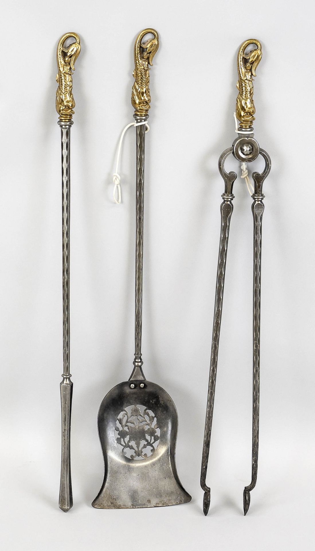 Renaissance-style fireplace set, 20th century, iron/brass. Consisting of tongs, poker and shovel, l.