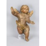 Floating putto, probably 19th century, carved and painted wood, h. 37 cm