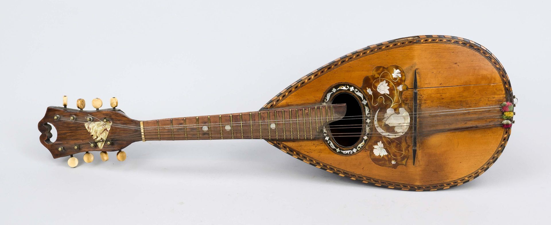 Mandolin, 19th/20th century, ribbed body, decorated with mother-of-pearl and ebony inlays, inside