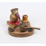 Smoking set, c. 1900, carved wood and horn, black and red Bakelite, fully sculpted bird with glass