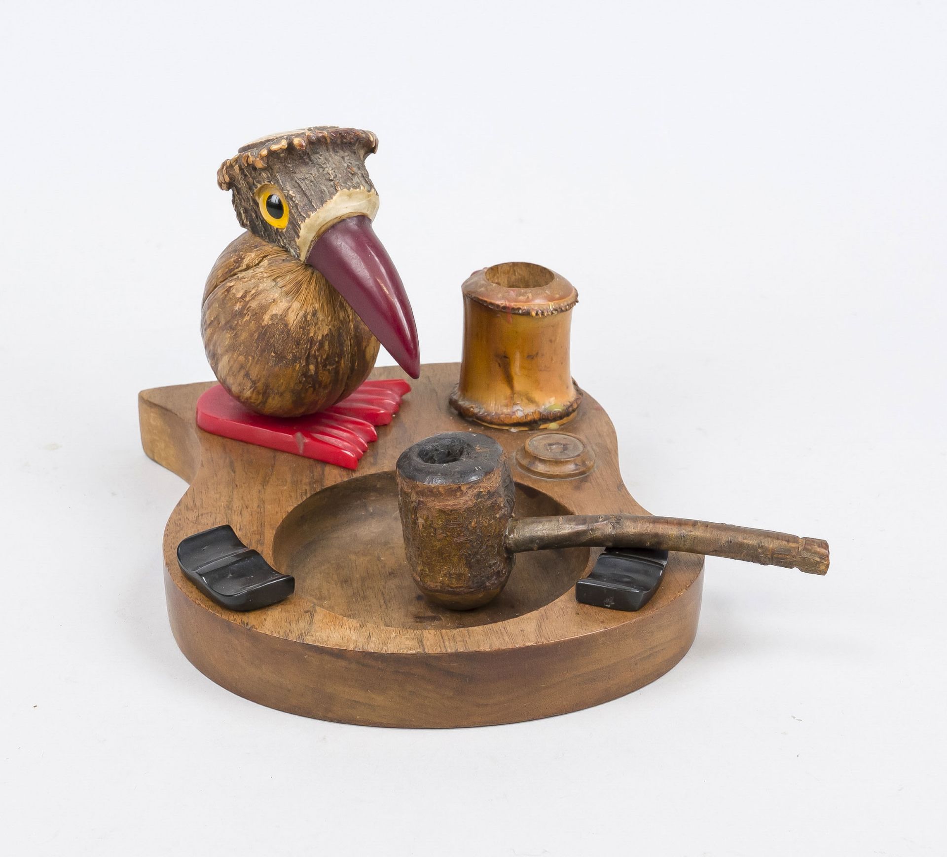 Smoking set, c. 1900, carved wood and horn, black and red Bakelite, fully sculpted bird with glass