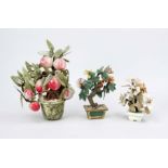 3 eternal flowers, China 20th century, various stones. Including a peach tree with plump fruit,