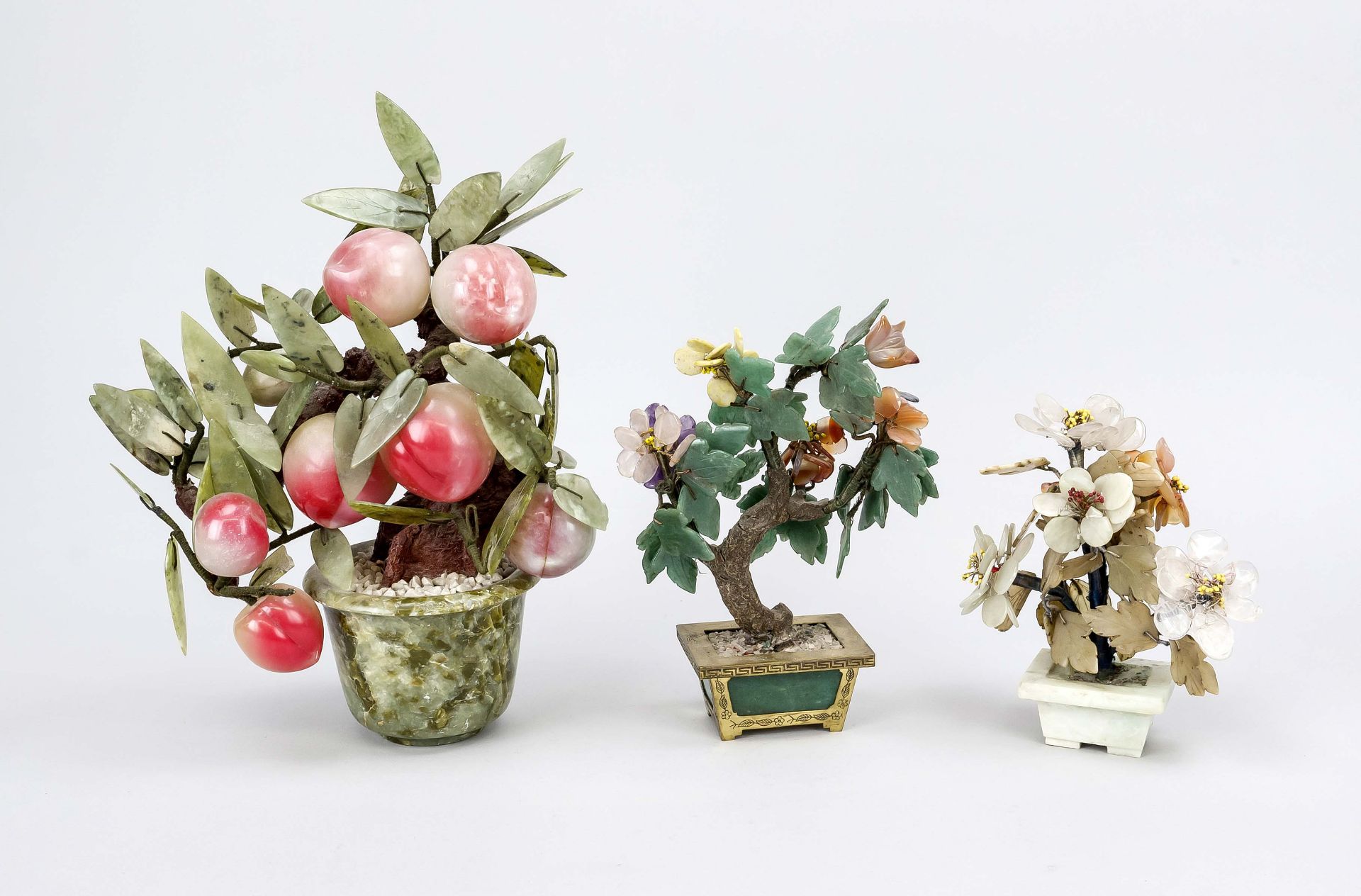 3 eternal flowers, China 20th century, various stones. Including a peach tree with plump fruit,