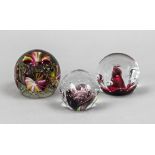 Three paperweights, 20th century, including Scotland, each spherical, clear glass with polychrome