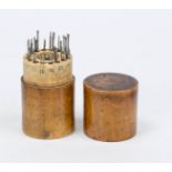 Set of spoon drills with spindle in round wooden case