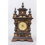 Biedermeier table clock, wood, oak, architectural design with gabled top, with applied gilt bronze